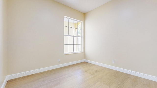 empty room with light hardwood / wood-style floors