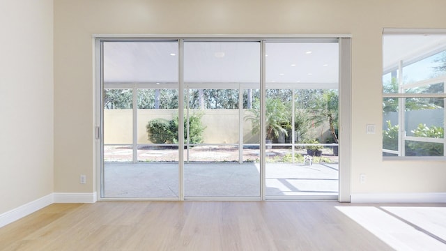 doorway with light hardwood / wood-style floors