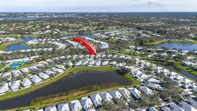 birds eye view of property with a water view