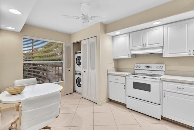 kitchen with ceiling fan, white cabinets, white electric stove, and stacked washing maching and dryer