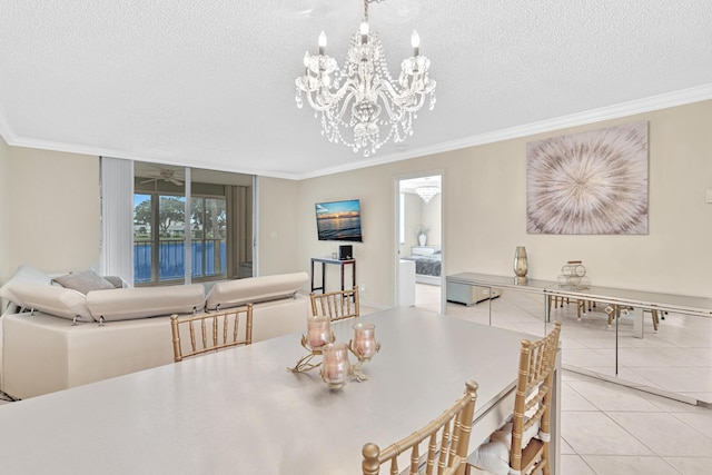 tiled dining area with a textured ceiling, crown molding, and a notable chandelier