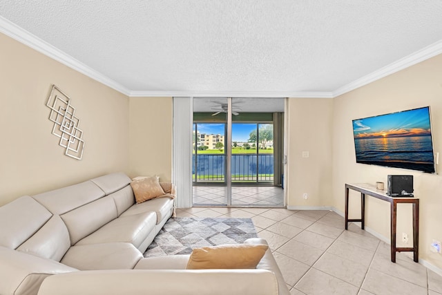 living room featuring light tile patterned floors, a textured ceiling, and ornamental molding