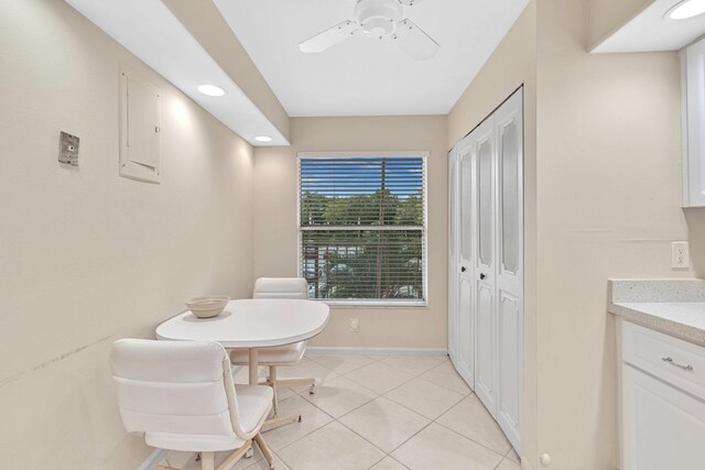 dining area featuring ceiling fan and light tile patterned floors