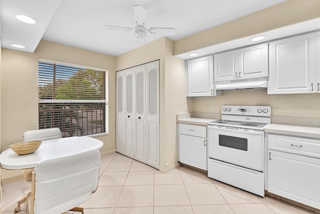 kitchen featuring light tile patterned floors, white range with electric stovetop, white cabinetry, and ceiling fan