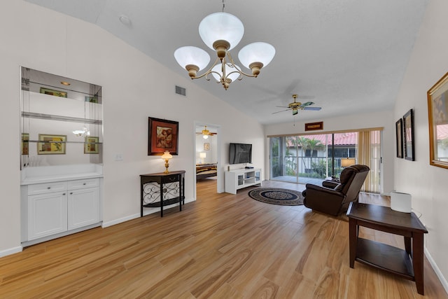 living room featuring ceiling fan with notable chandelier, light hardwood / wood-style floors, and high vaulted ceiling