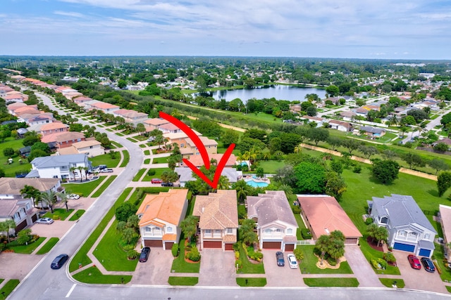 birds eye view of property with a water view