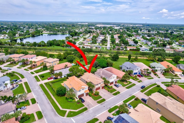 birds eye view of property featuring a water view