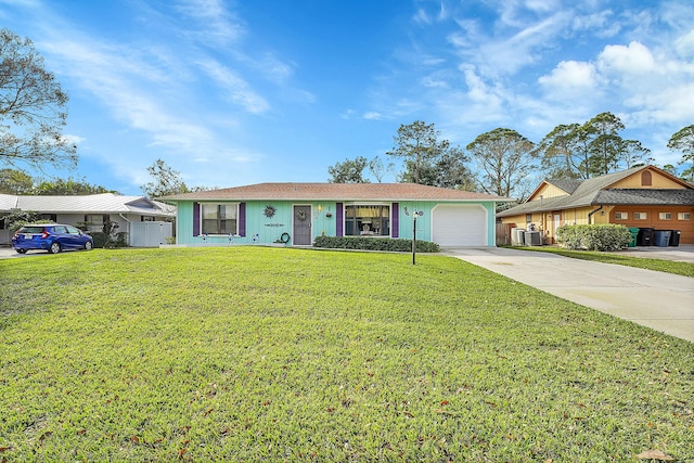 ranch-style home with a garage and a front yard