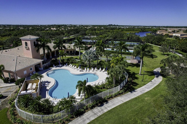 view of swimming pool featuring a lawn