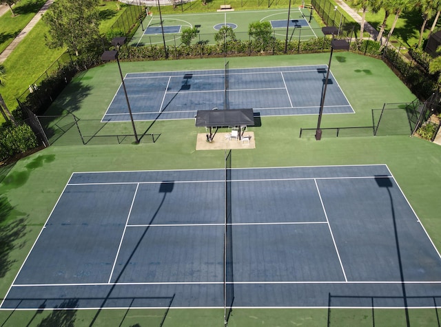 view of sport court featuring basketball hoop