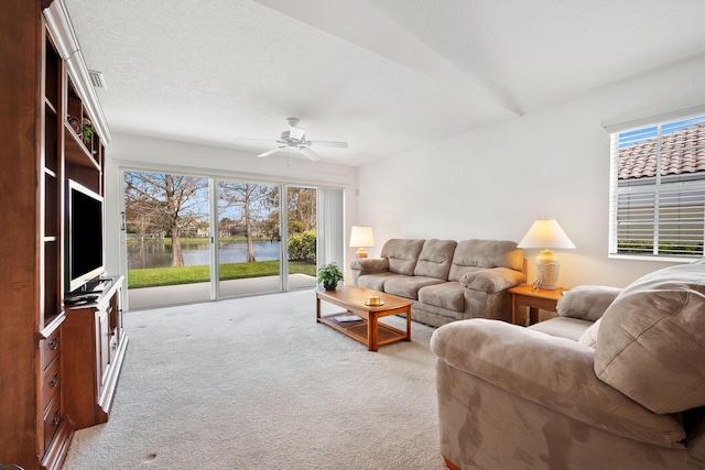 living room with light colored carpet and ceiling fan