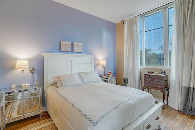 bedroom with light wood-type flooring