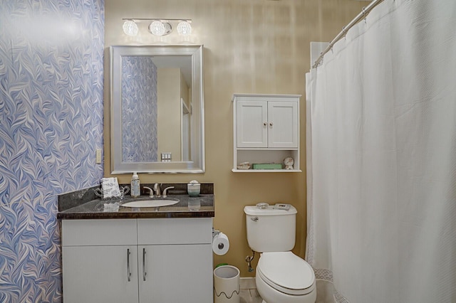 bathroom with vanity and toilet