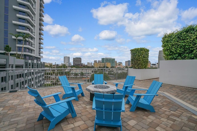 view of patio with an outdoor fire pit