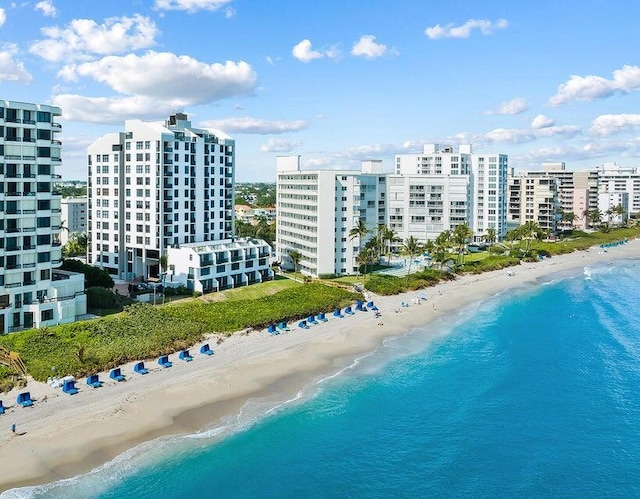 aerial view featuring a view of the beach and a water view