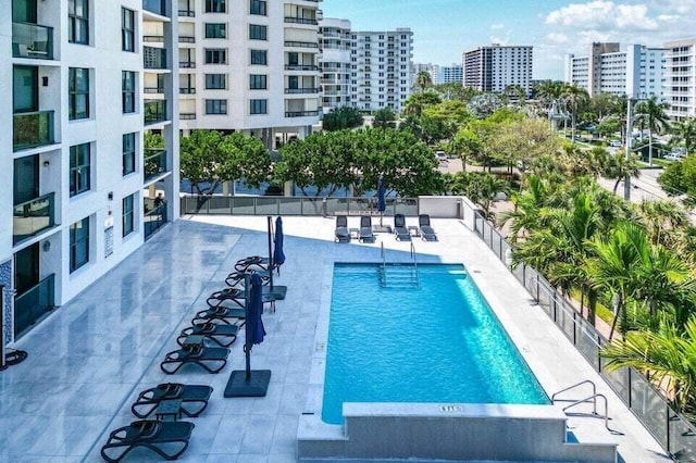 view of swimming pool featuring a patio area