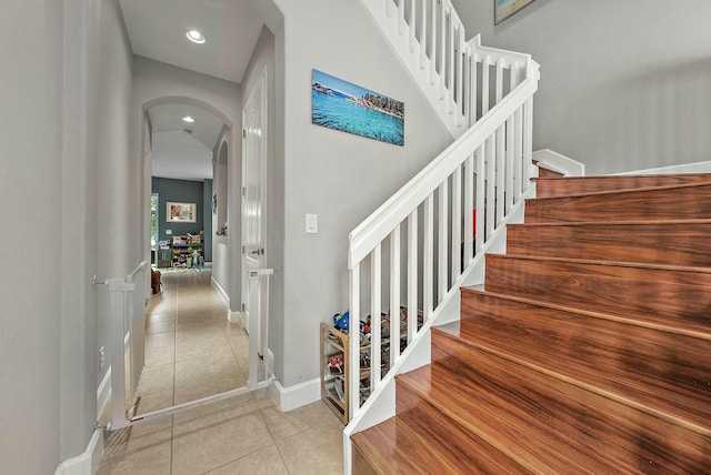 staircase with tile patterned flooring