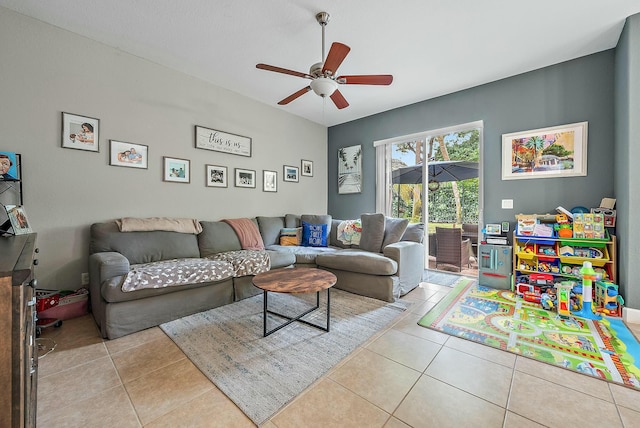 living room featuring ceiling fan and light tile patterned floors