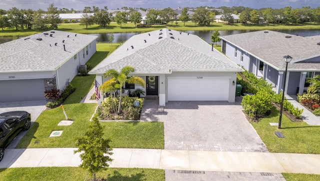 drone / aerial view featuring a water view