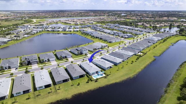 birds eye view of property with a water view