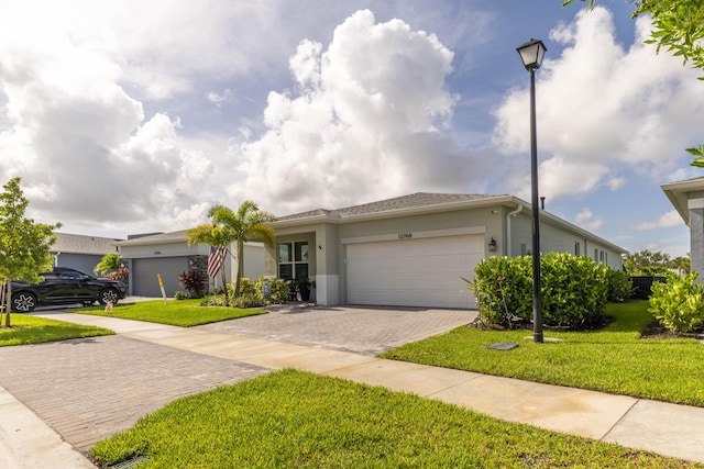 ranch-style home with a front yard and a garage