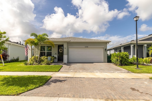 ranch-style house with a front lawn and a garage