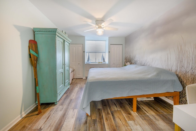 bedroom featuring ceiling fan and wood-type flooring