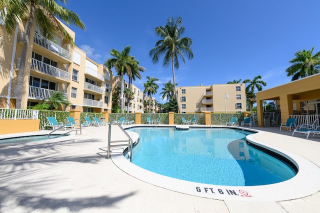 view of swimming pool with a patio area