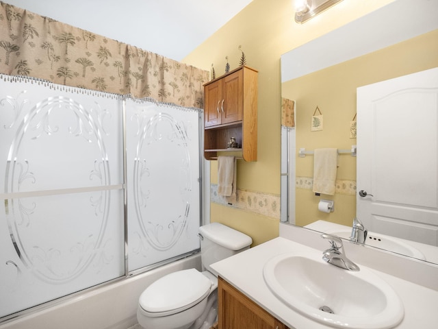 full bathroom with toilet, enclosed tub / shower combo, and vanity