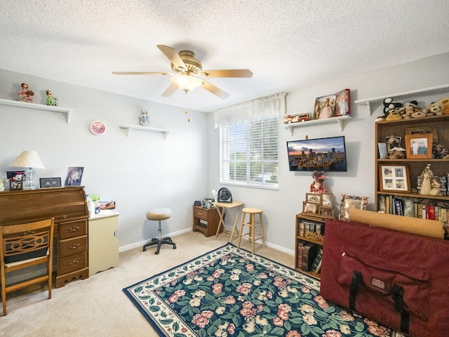 interior space featuring ceiling fan and a textured ceiling