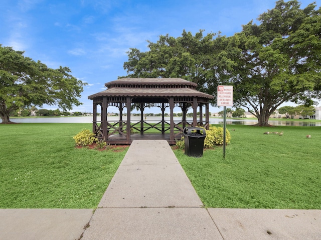 view of property's community featuring a gazebo, a yard, and a water view