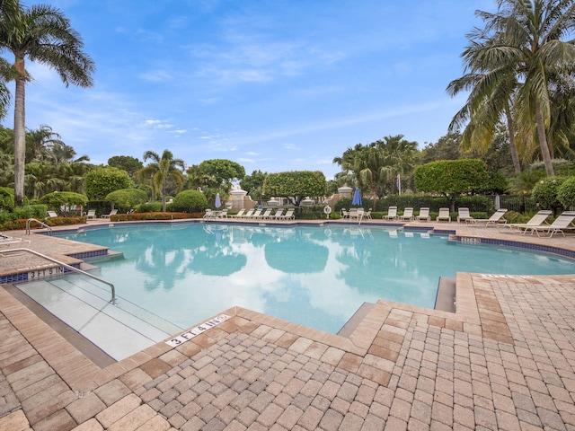 view of swimming pool with a patio area