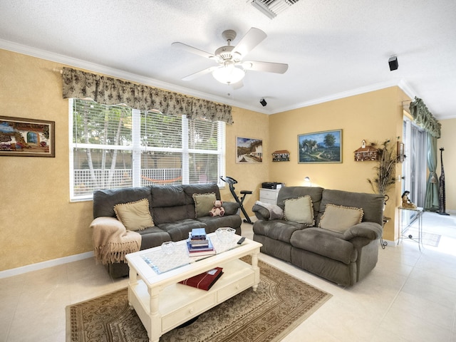 living room featuring ceiling fan, a textured ceiling, light tile patterned floors, and crown molding