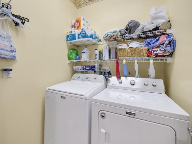 laundry area featuring washing machine and clothes dryer