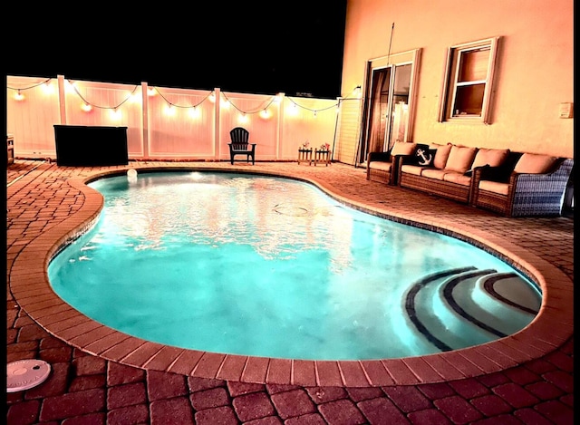 view of swimming pool with an outdoor hangout area and a patio area