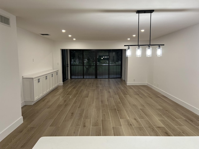 unfurnished dining area featuring light hardwood / wood-style flooring