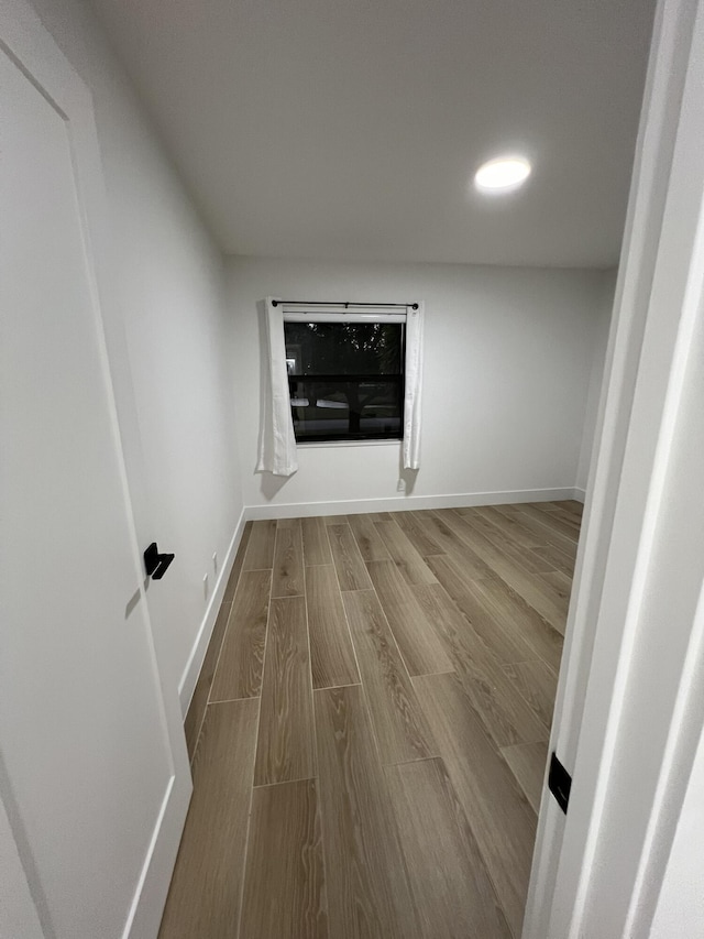 empty room featuring wood-type flooring