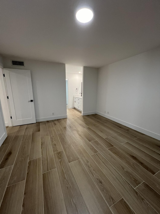 empty room featuring wood-type flooring