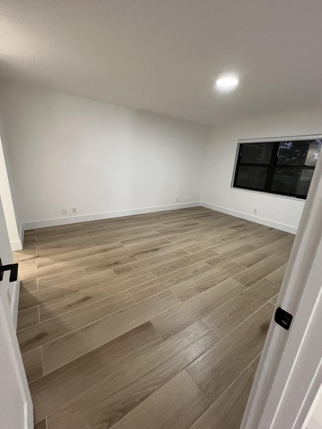 unfurnished room featuring hardwood / wood-style floors