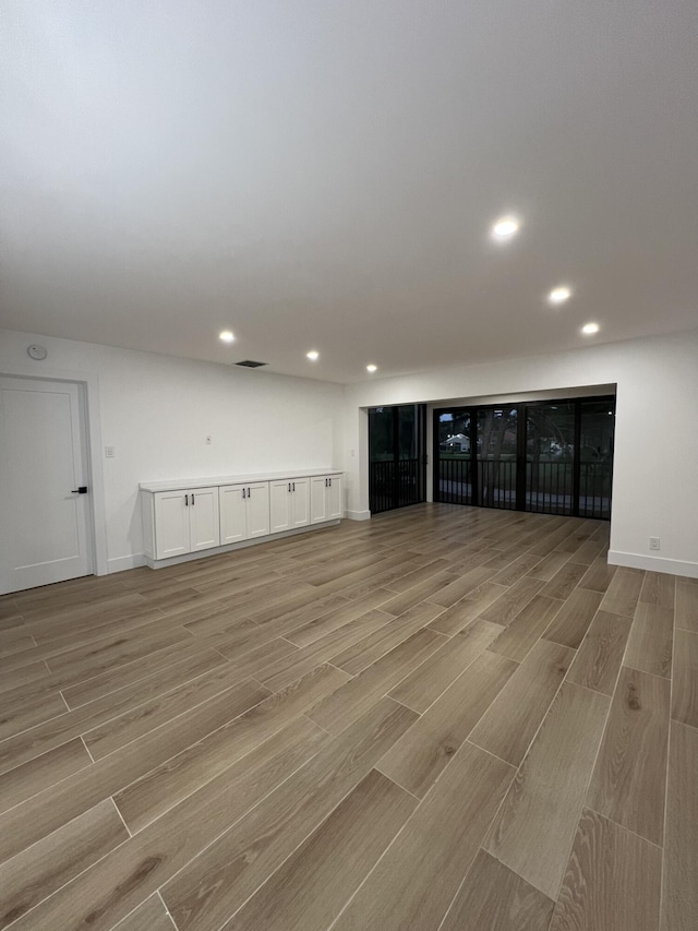 basement featuring light hardwood / wood-style flooring