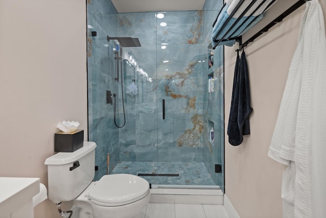 bathroom with tile patterned flooring, an enclosed shower, and toilet