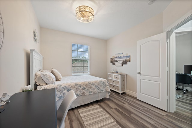 bedroom with wood-type flooring