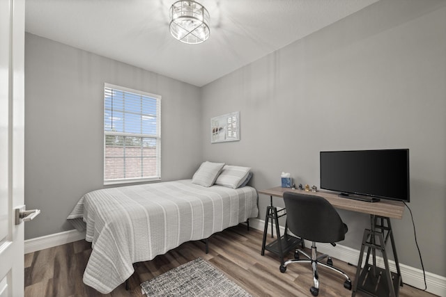 bedroom with hardwood / wood-style floors