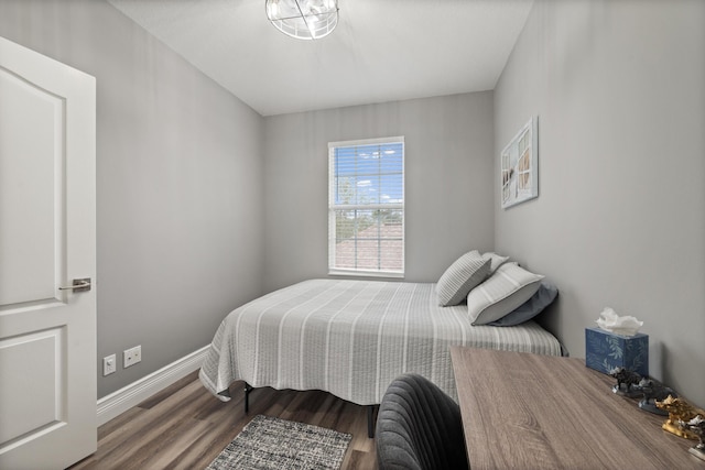 bedroom with hardwood / wood-style floors