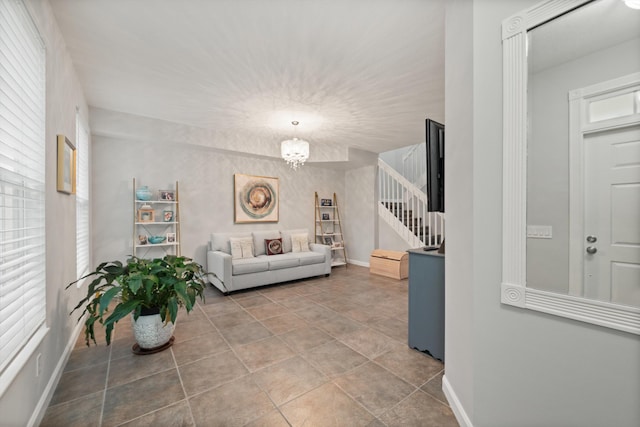 living room with a notable chandelier