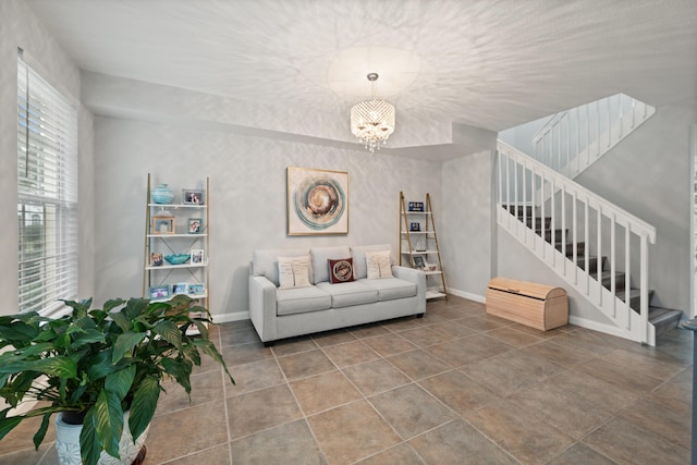 living room featuring an inviting chandelier