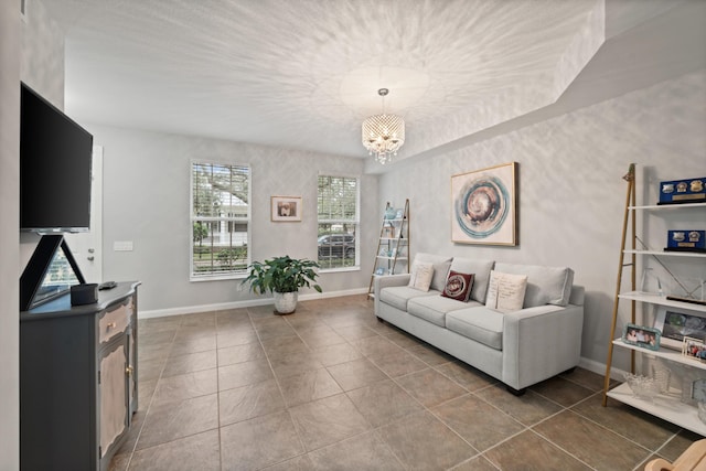 living room with tile patterned floors and a notable chandelier