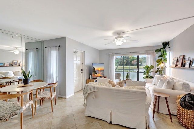 living room with ceiling fan and light tile patterned floors