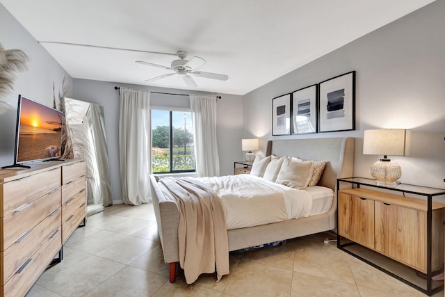 bedroom with ceiling fan and light tile patterned floors