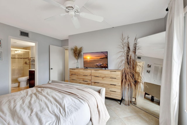 tiled bedroom with ceiling fan and ensuite bathroom